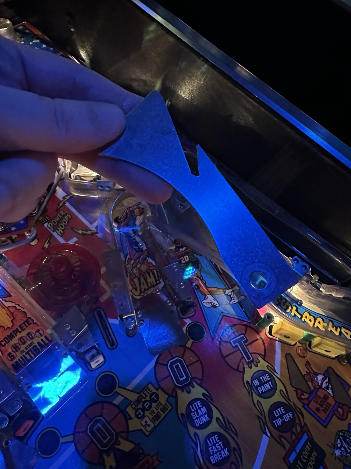 A loose diverter being shown over the playfield